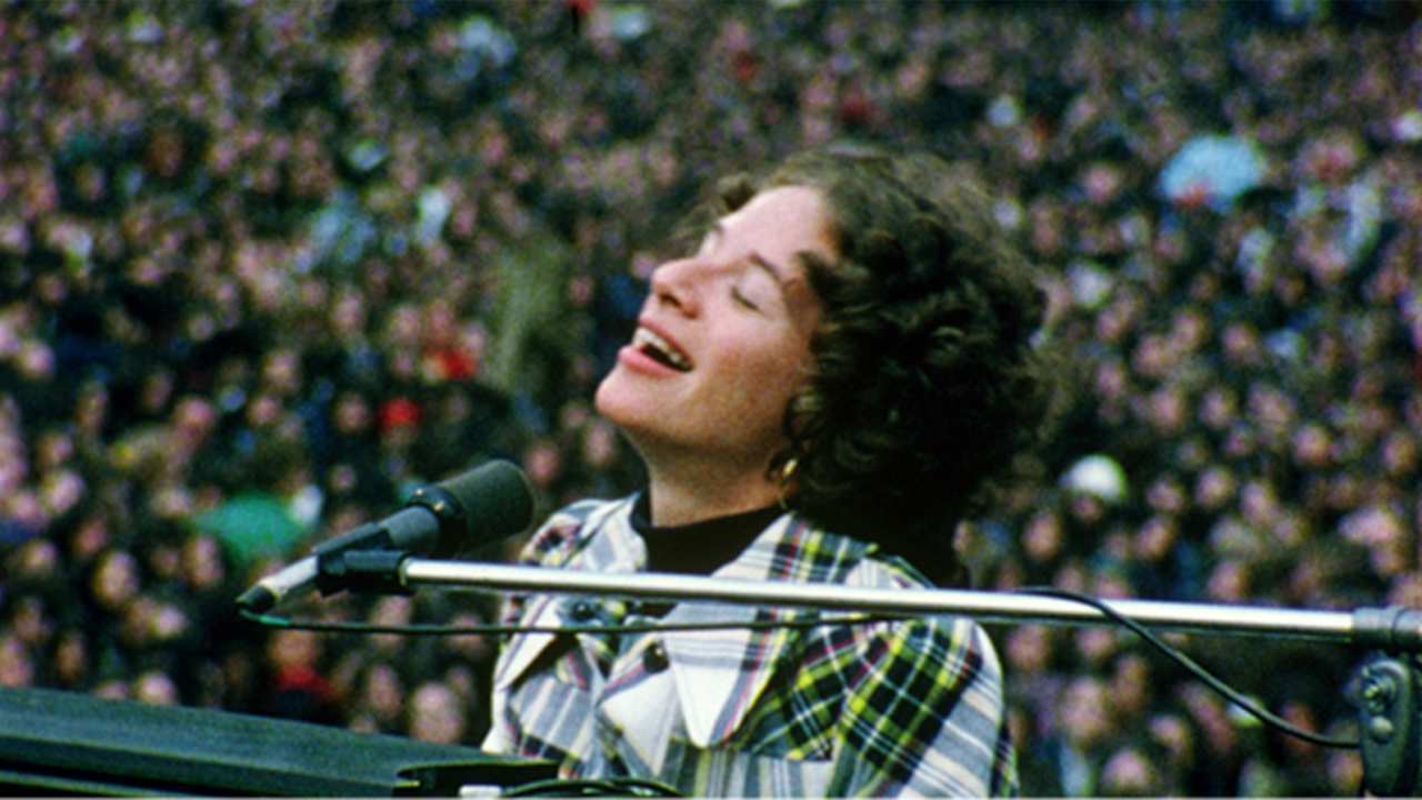 a woman singing into a microphone